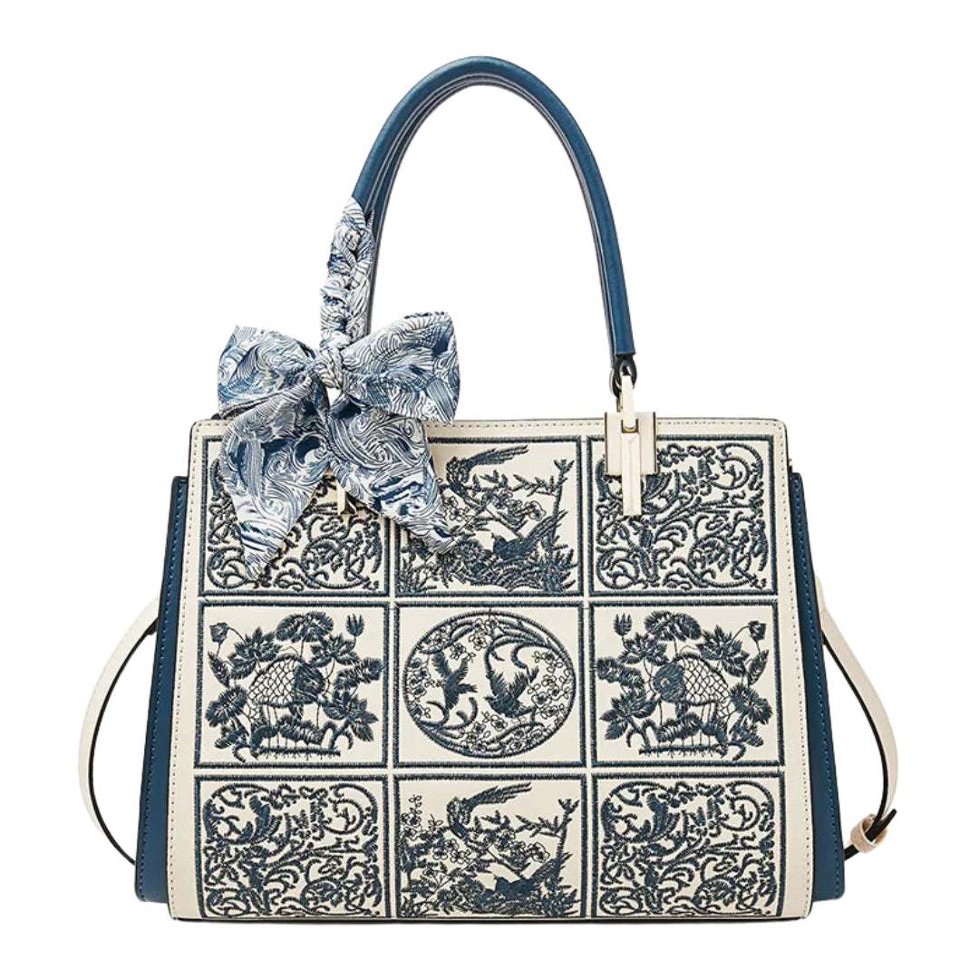 Sylvia™ – Wyjątkowa torebka crossbody z haftem i kokardą