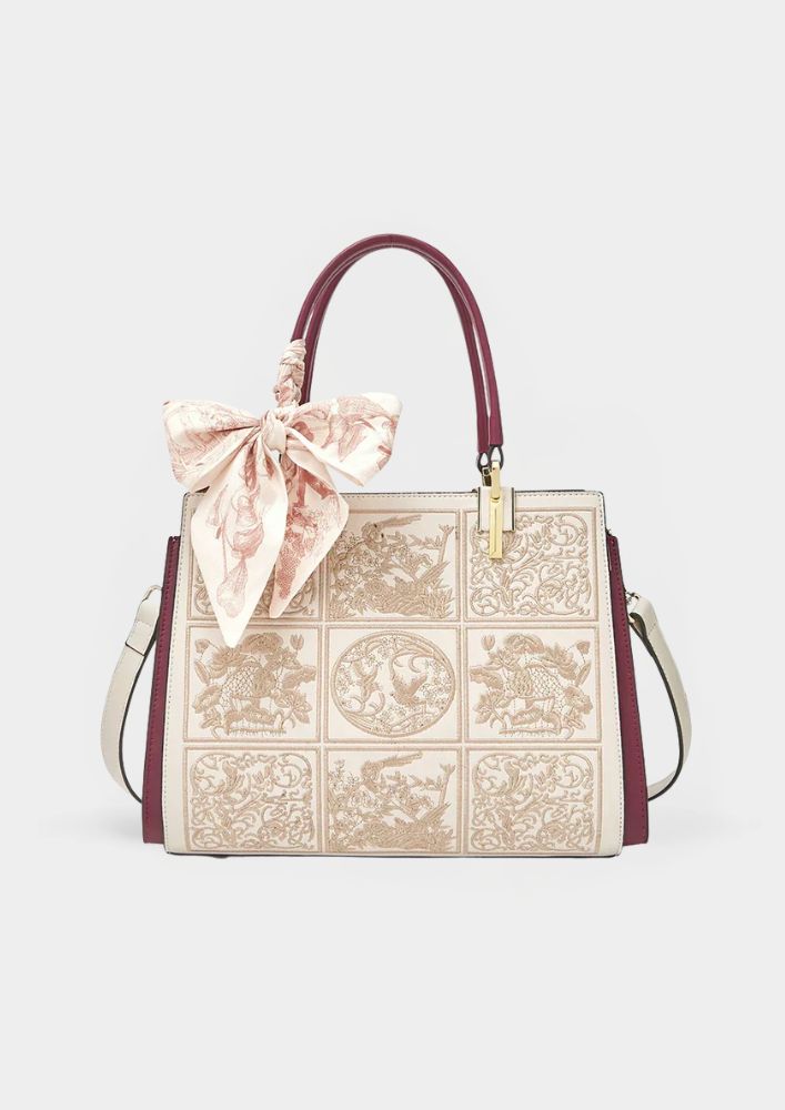 Sylvia™ – Wyjątkowa torebka crossbody z haftem i kokardą
