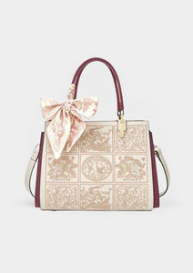 Sylvia™ – Wyjątkowa torebka crossbody z haftem i kokardą
